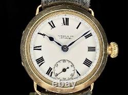 1920s Russells LTD Liverpool 9ct gold Dennison 31mm watch Enamel dial, serviced