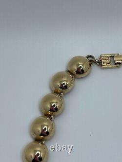 Vintage Givenchy Gold Tone Cream Black Enamel X Circle Necklace