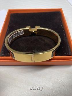Bracelet Hermès Clic H en émail noir plaqué or avec boîte - Authentique